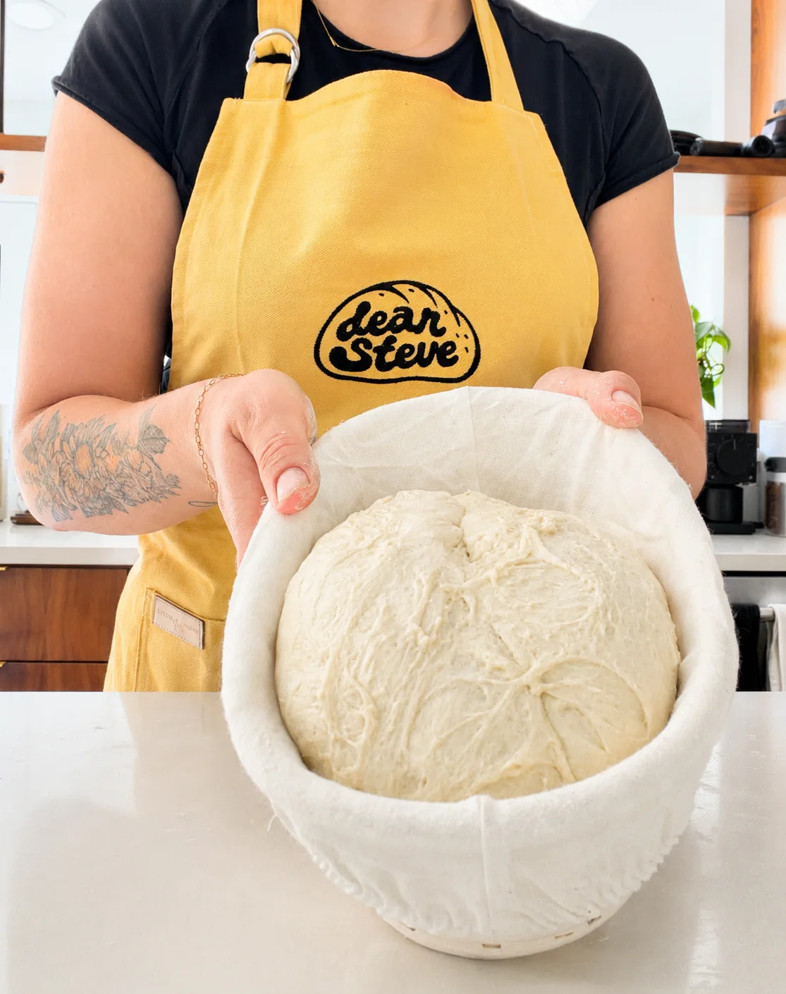 Sourdough being mixed and folded by hand